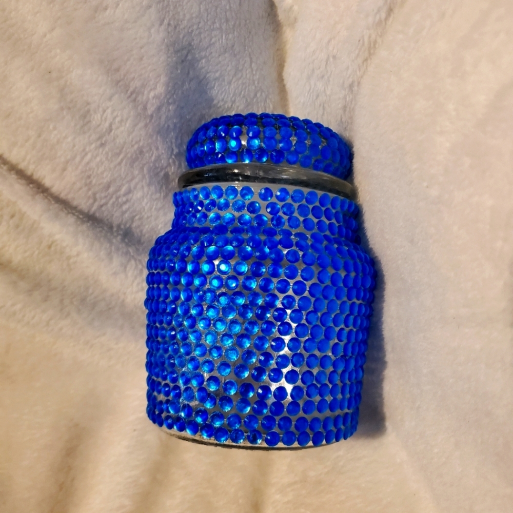 Glass jar with rhinestone finish.